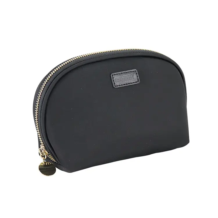OEM half moon makeup pouch supplier demonstrating metal logo plates and metallic custom embroidery